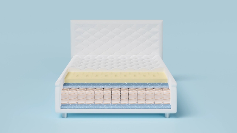 Prikazan je presečni model koji pokazuje slojeve idealnog dušeka za diskus herniju sa kombinacijom pene i opruga za stabilnu podršku